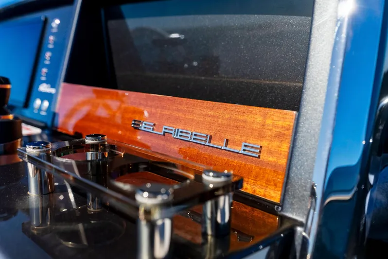 Arcadia Yacht Photos Pics Riva 66' Ribelle 2020 yacht dashboard with sleek design and wood accents.