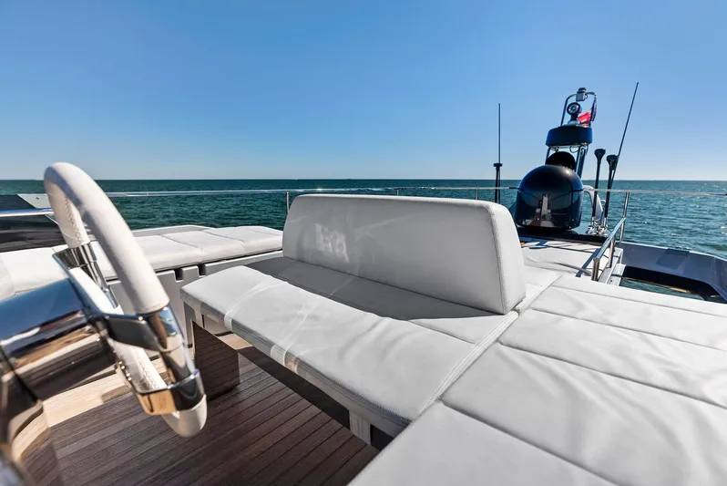 Arcadia Yacht Photos Pics Luxurious 2020 Riva 66' Ribelle yacht with elegant deck seating and ocean view.