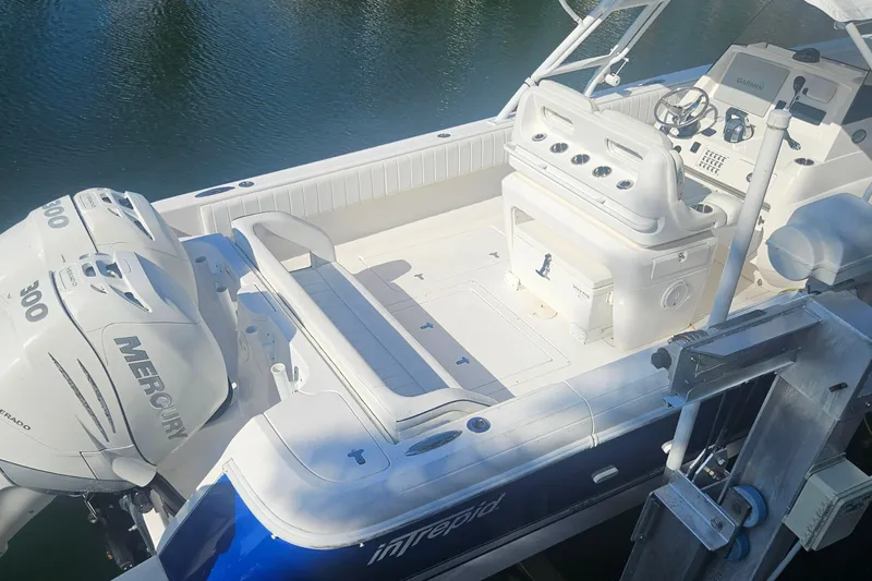  Yacht Photos Pics 2015 Intrepid 327 Center Console boat with dual Mercury 300 engines docked on water.