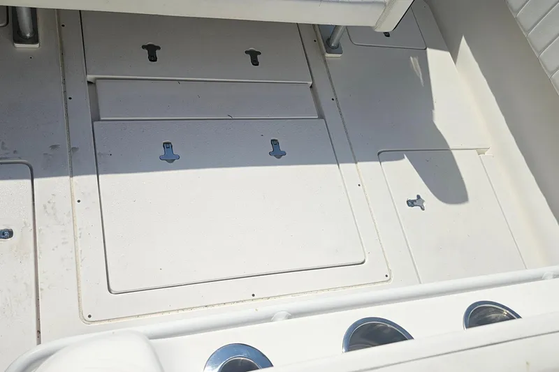  Yacht Photos Pics 2015 Intrepid 327 Center Console deck with storage compartments and cup holders.