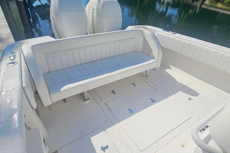  Yacht Photos Pics 2015 Intrepid 327 Center Console boat interior with white seating and dual engines.