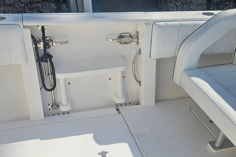  Yacht Photos Pics 2015 Intrepid 327 Center Console interior with white seating and storage area.