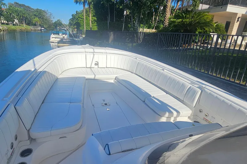  Yacht Photos Pics 2015 Intrepid 327 Center Console boat with spacious white seating on a sunny day.