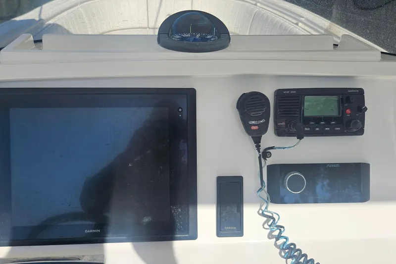  Yacht Photos Pics 2015 Intrepid 327 Center Console dashboard with Garmin electronics and VHF radio.