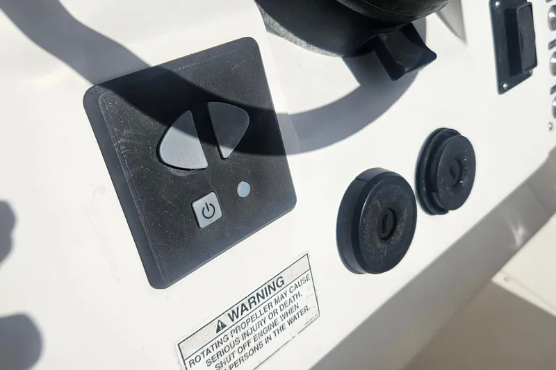  Yacht Photos Pics Control panel of a 2015 Intrepid 327 Center Console boat with warning label.
