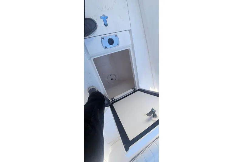  Yacht Photos Pics Open storage compartment on 2015 Intrepid 327 Center Console boat deck.