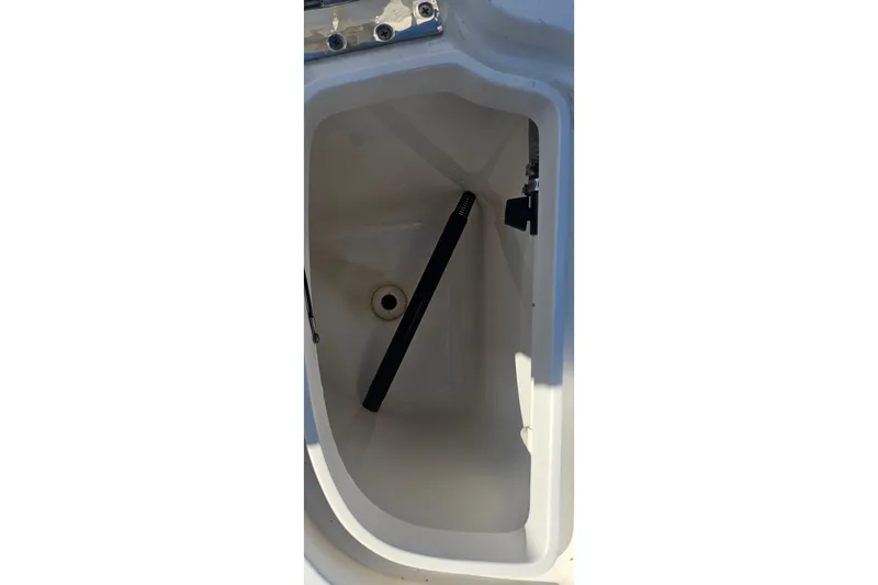  Yacht Photos Pics Storage compartment of 2015 Intrepid 327 Center Console boat, featuring a clean interior.