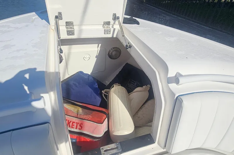  Yacht Photos Pics Open storage compartment on 2015 Intrepid 327 Center Console boat with life jackets and gear.
