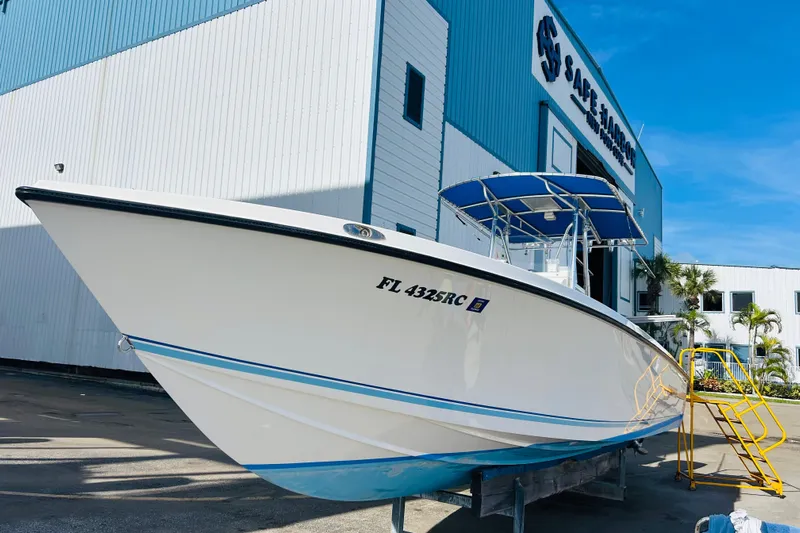  Yacht Photos Pics Whitewater OSB 2016 boat docked at Safe Harbor marina under clear blue sky.