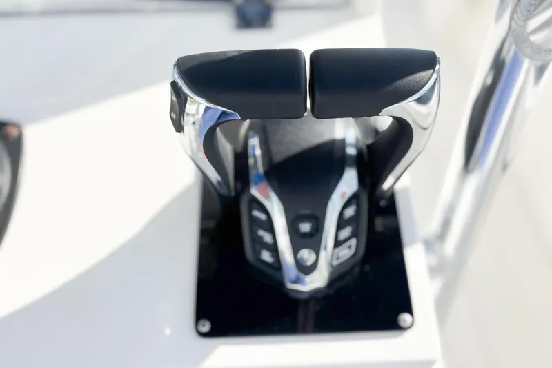  Yacht Photos Pics Close-up of a 2016 Whitewater boat throttle control lever on a white surface.