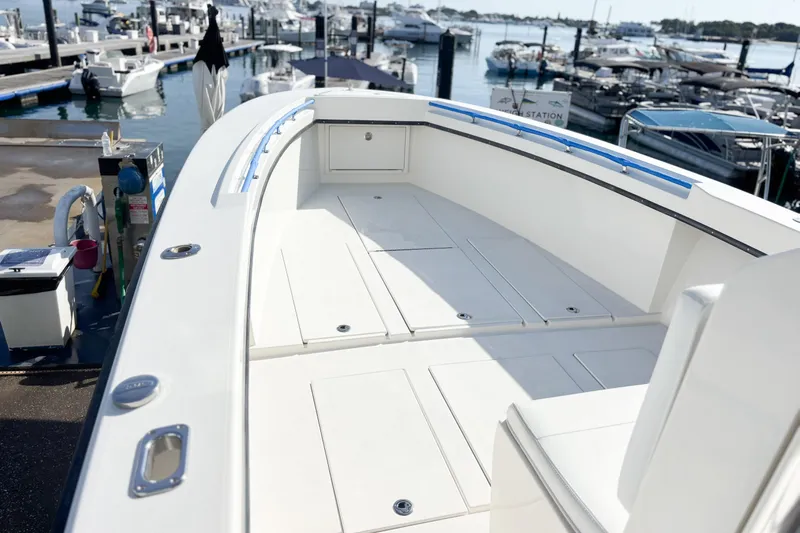  Yacht Photos Pics 2016 Whitewater boat deck at marina, showcasing spacious layout and sleek design.