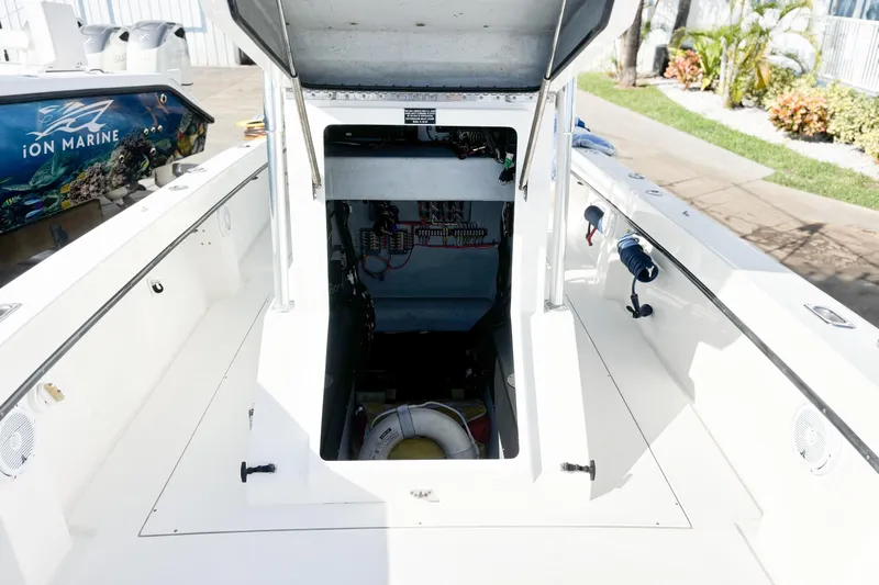  Yacht Photos Pics Open hatch on a 2016 Whitewater boat, revealing interior wiring and equipment.