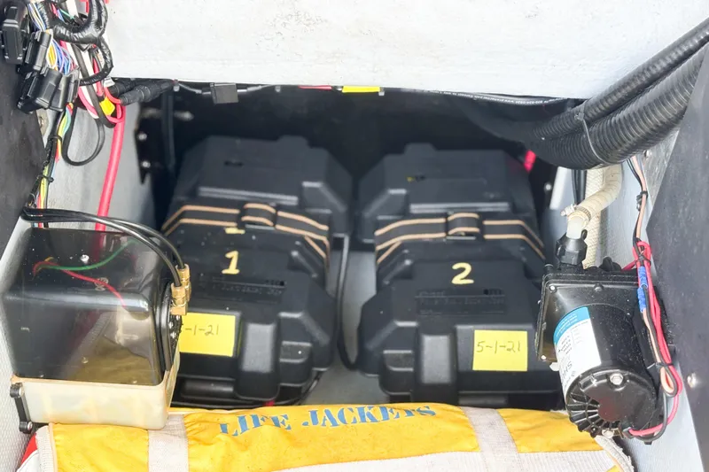  Yacht Photos Pics Battery compartment of a 2016 Whitewater boat with wiring and life jackets.