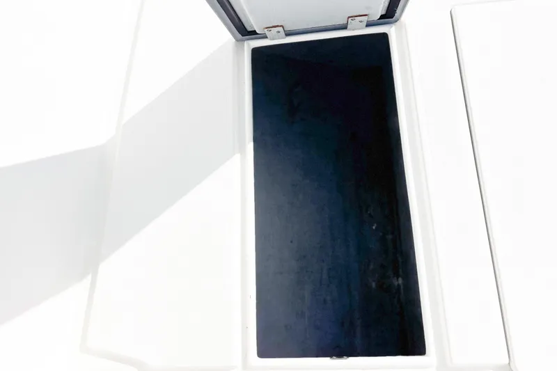  Yacht Photos Pics Open storage compartment on a 2016 Whitewater boat, showing interior space.