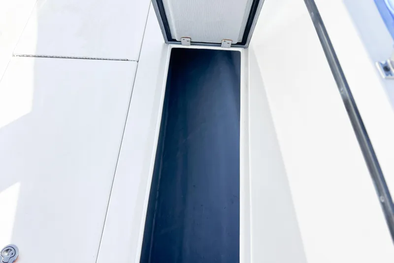  Yacht Photos Pics Open storage compartment on a 2016 Whitewater boat, featuring a sleek design.