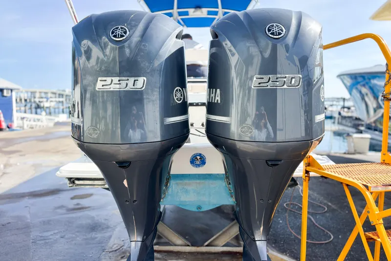  Yacht Photos Pics Twin Yamaha 250 outboard motors on a 2016 Whitewater boat at a marina.