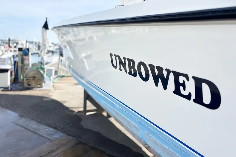  Yacht Photos Pics Whitewater boat named "Unbowed" docked, 2016 model, side view.
