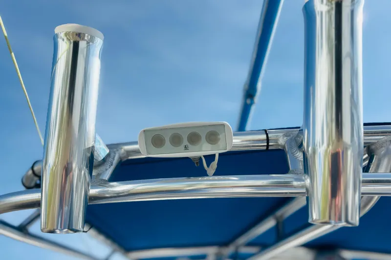  Yacht Photos Pics Close-up of a 2016 Whitewater boat's metal frame and mounted equipment under a clear sky.