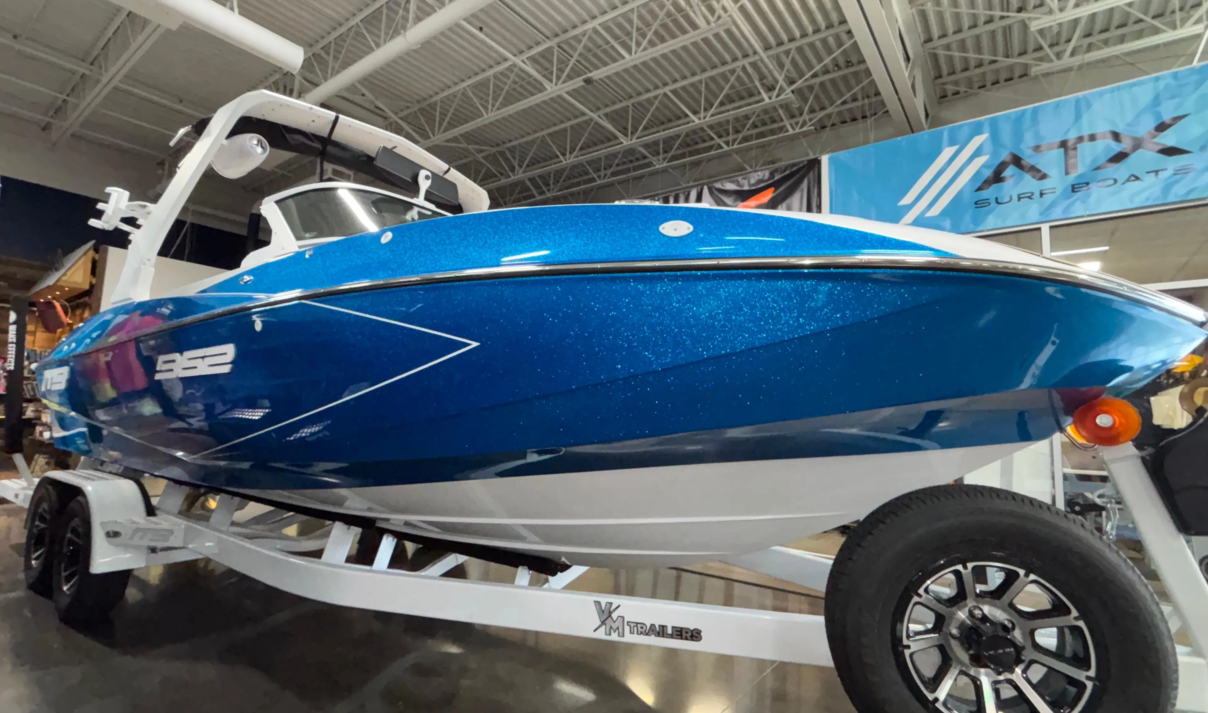 2025 MB B52 23 Classic boat in showroom, blue exterior, on trailer.