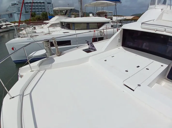 High Life Yacht Photos Pics Leopard 43 Powercat 2020 yacht docked in marina, showcasing spacious deck and sleek design.