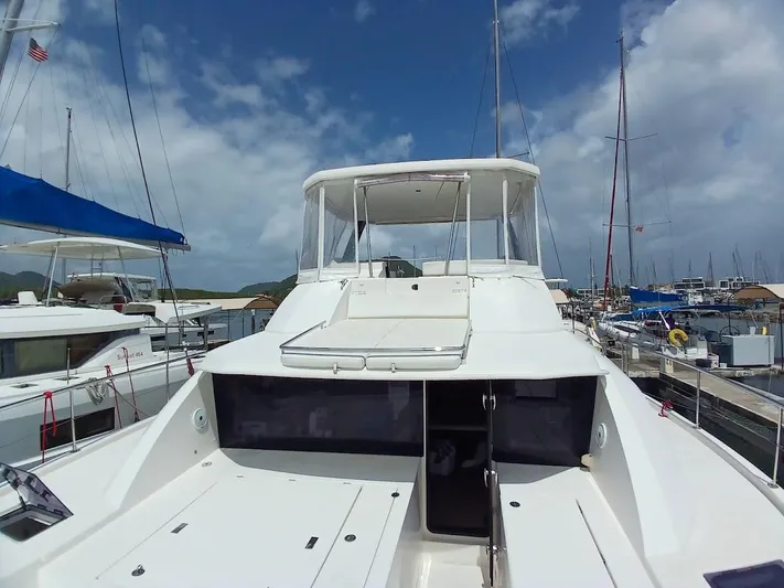High Life Yacht Photos Pics 2020 Leopard 43 Powercat yacht docked at marina under blue sky.