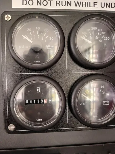 High Life Yacht Photos Pics Instrument panel of a 2020 Leopard 43 Powercat showing gauges and hour meter.