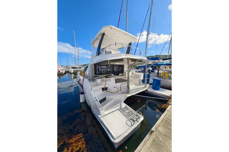 High Life Yacht Photos Pics 2020 Leopard 43 Powercat docked at marina under clear blue sky.
