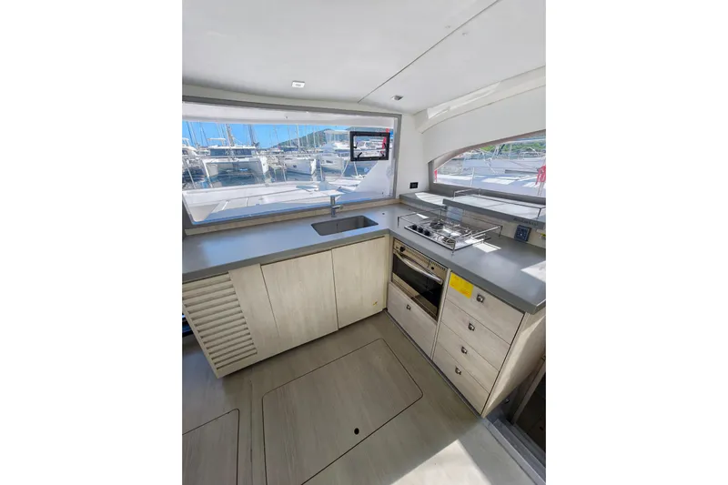High Life Yacht Photos Pics Modern kitchen interior of 2020 Leopard 43 Powercat yacht with sleek countertops and appliances.