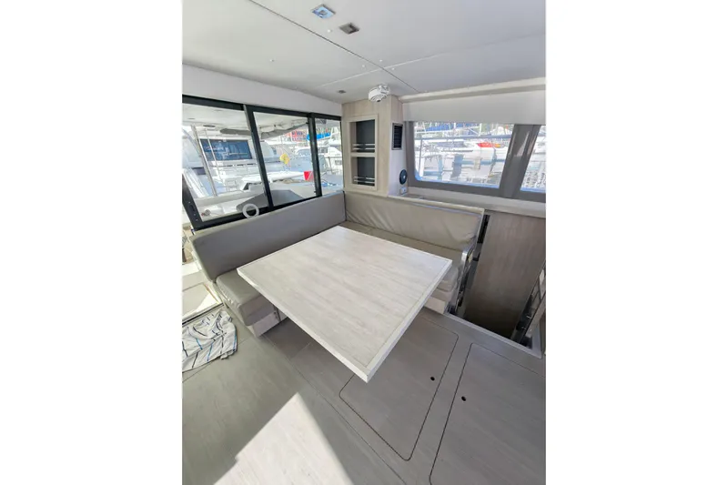 High Life Yacht Photos Pics Interior of 2020 Leopard 43 Powercat with modern dining area and large windows.