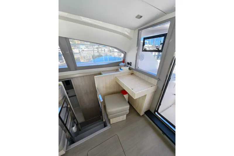 High Life Yacht Photos Pics Interior of 2020 Leopard 43 Powercat, featuring a compact desk and seating area.