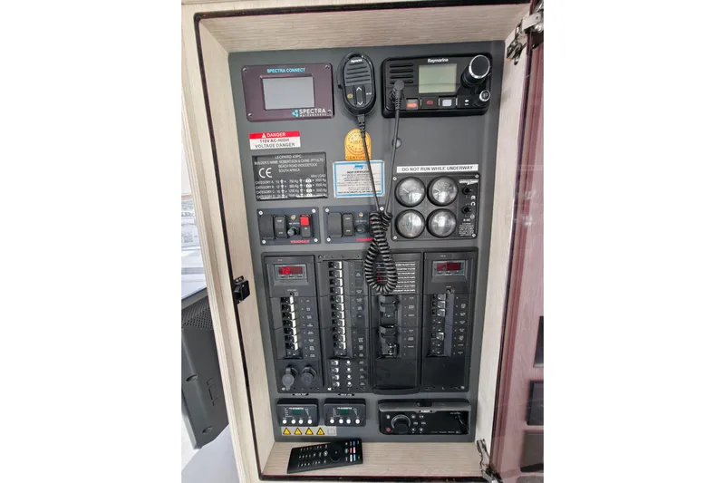High Life Yacht Photos Pics Electrical control panel of a 2020 Leopard 43 Powercat boat with various instruments and switches.