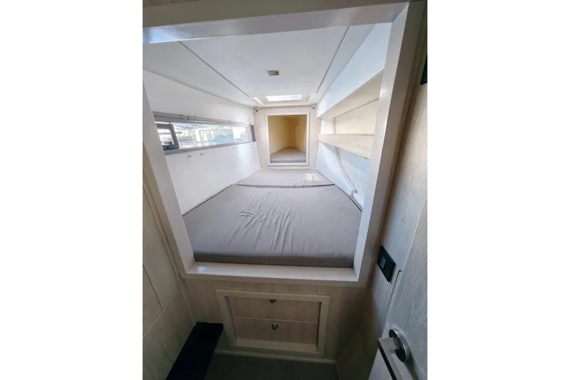 High Life Yacht Photos Pics Interior cabin of 2020 Leopard 43 Powercat, featuring a cozy bed and modern design.
