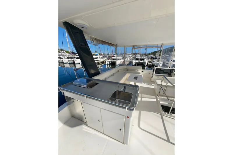 High Life Yacht Photos Pics 2020 Leopard 43 Powercat yacht interior with sleek kitchen and marina view.