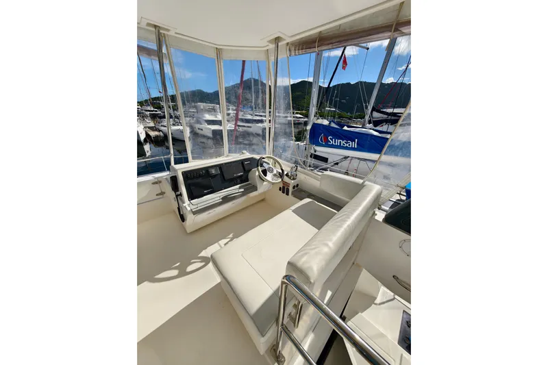 High Life Yacht Photos Pics Interior view of 2020 Leopard 43 Powercat yacht helm with marina backdrop.