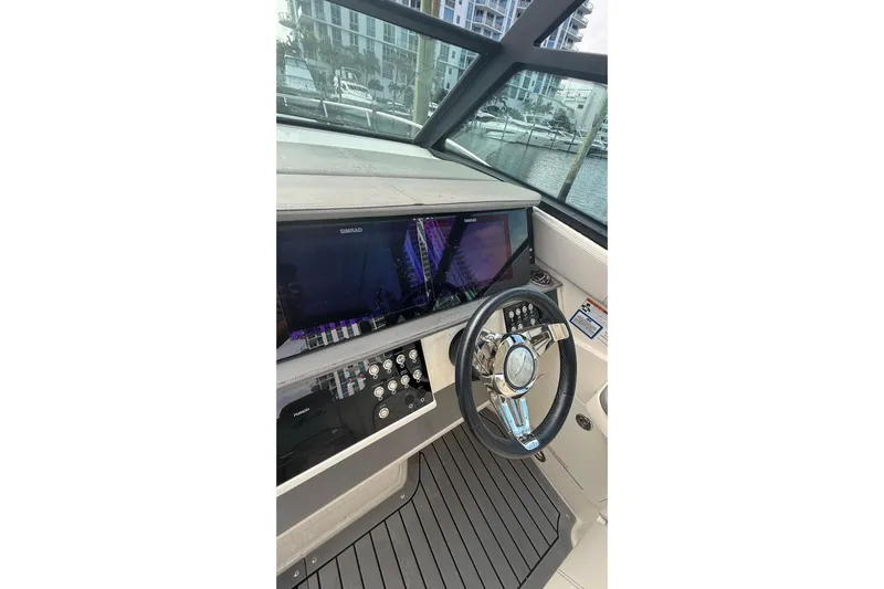 Mercy Yacht Photos Pics 2021 Sea Ray Sundancer 320 helm with modern controls and navigation display.