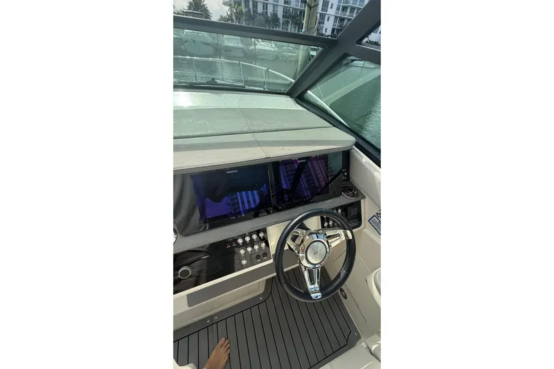 Mercy Yacht Photos Pics 2021 Sea Ray Sundancer 320 helm with modern controls and steering wheel.