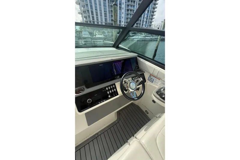Mercy Yacht Photos Pics 2021 Sea Ray Sundancer 320 helm with modern controls and sleek design.