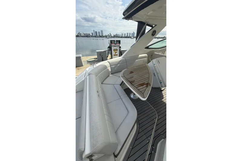 Mercy Yacht Photos Pics 2021 Sea Ray Sundancer 320 yacht interior with elegant seating and waterfront view.