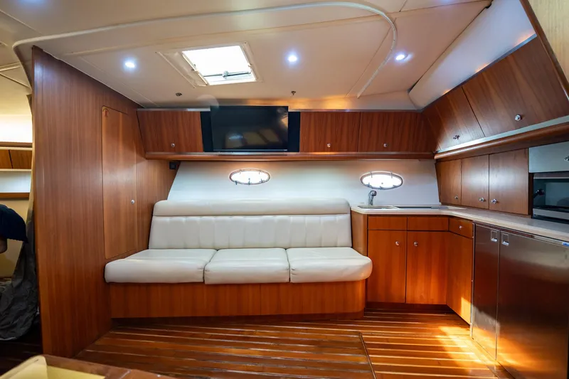 Blue Pearl Yacht Photos Pics Luxurious 2004 Tiara Yachts 4200 Open interior with wood cabinetry and plush seating.