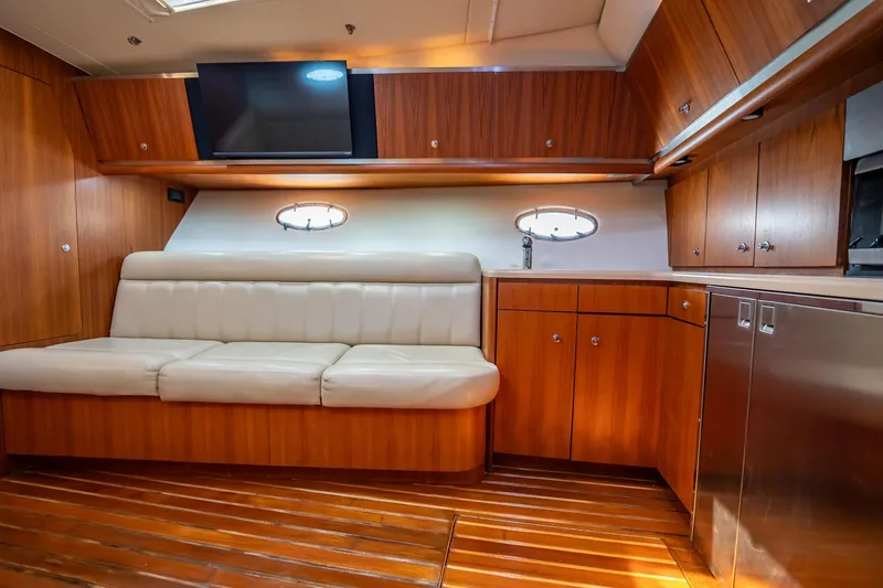 Blue Pearl Yacht Photos Pics Luxurious 2004 Tiara Yachts 4200 Open interior with wood cabinetry and leather seating.