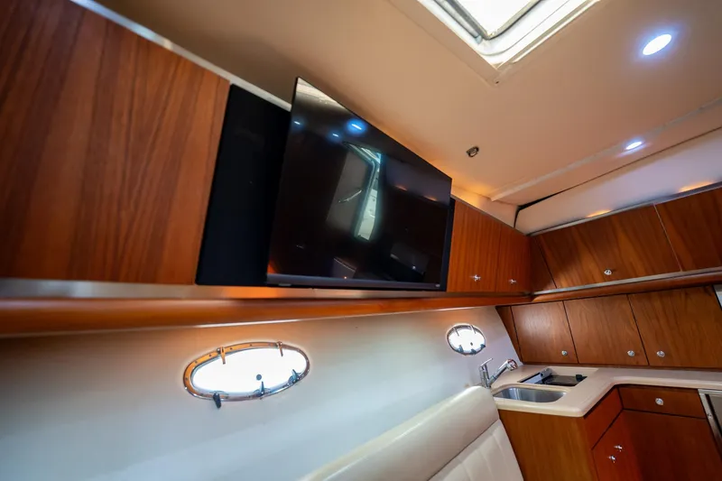 Blue Pearl Yacht Photos Pics Interior of 2004 Tiara Yachts 4200 Open with wood cabinetry and modern amenities.