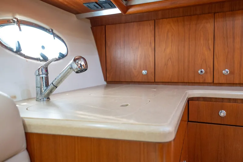 Blue Pearl Yacht Photos Pics 2004 Tiara Yachts 4200 Open interior with wooden cabinets and modern sink.