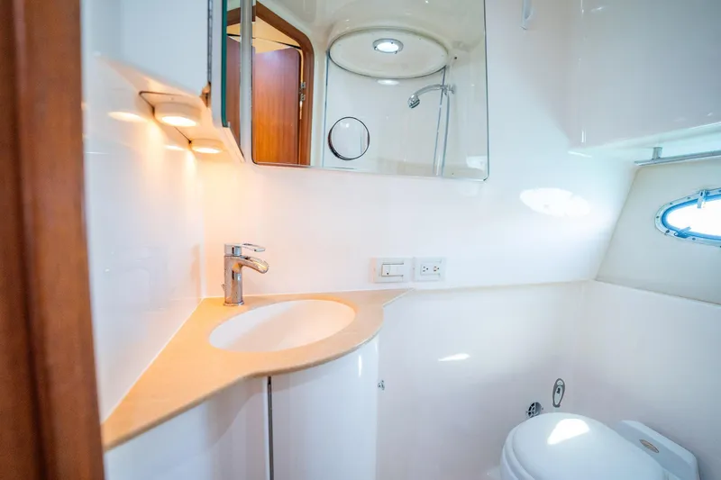 Blue Pearl Yacht Photos Pics Luxurious bathroom in 2004 Tiara Yachts 4200 Open, featuring modern fixtures and elegant design.