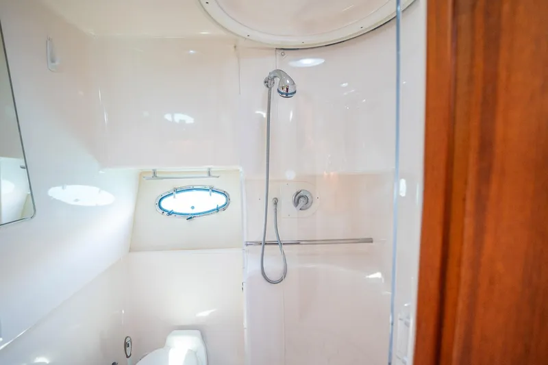 Blue Pearl Yacht Photos Pics 2004 Tiara Yachts 4200 Open bathroom with shower and porthole window.