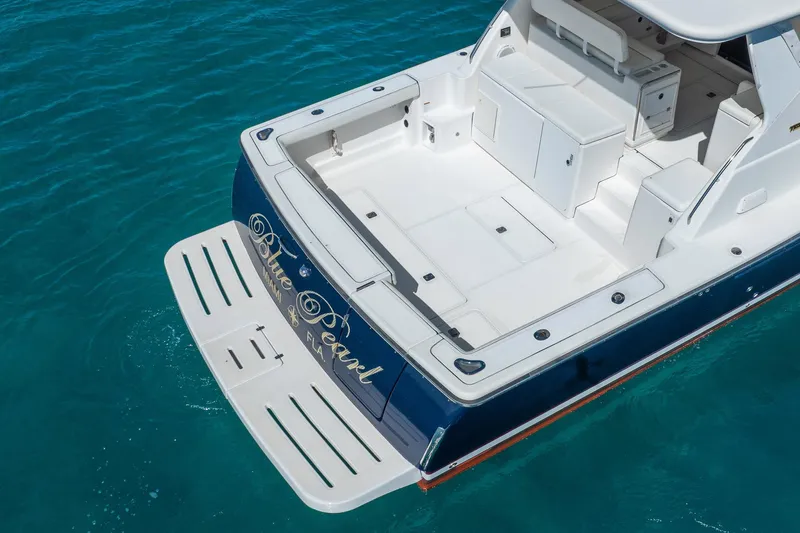 Blue Pearl Yacht Photos Pics 2004 Tiara Yachts 4200 Open boat on clear blue water, featuring spacious deck.