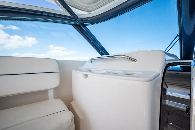 Blue Pearl Yacht Photos Pics Interior view of 2004 Tiara Yachts 4200 Open, featuring sleek seating and clear blue skies.