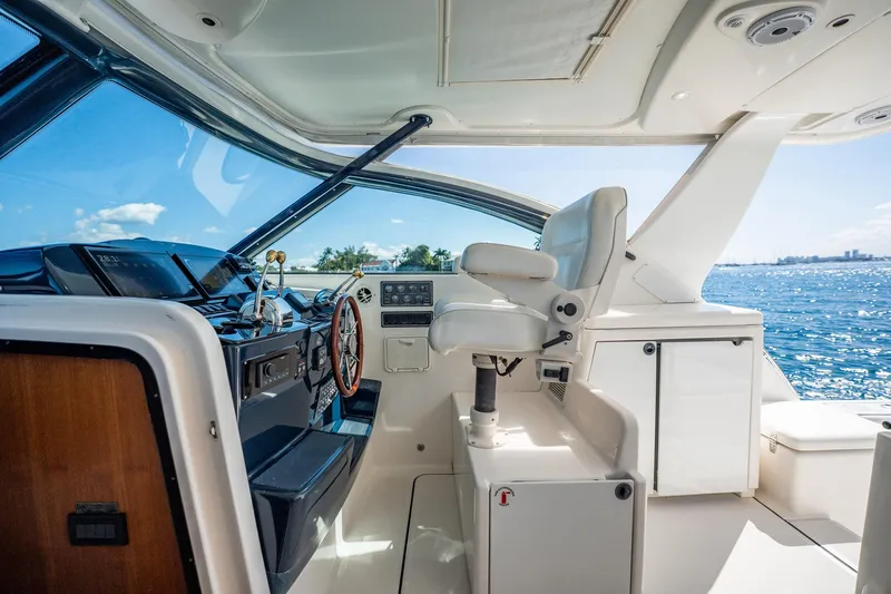 Blue Pearl Yacht Photos Pics 2004 Tiara Yachts 4200 Open helm with ocean view, featuring modern controls and seating.