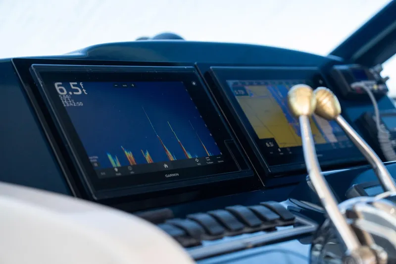 Blue Pearl Yacht Photos Pics Dashboard of a 2004 Tiara Yachts 4200 Open with navigation screens and controls.