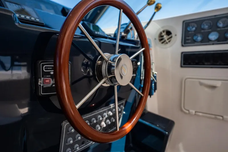 Blue Pearl Yacht Photos Pics Steering wheel of 2004 Tiara Yachts 4200 Open, showcasing dashboard controls.