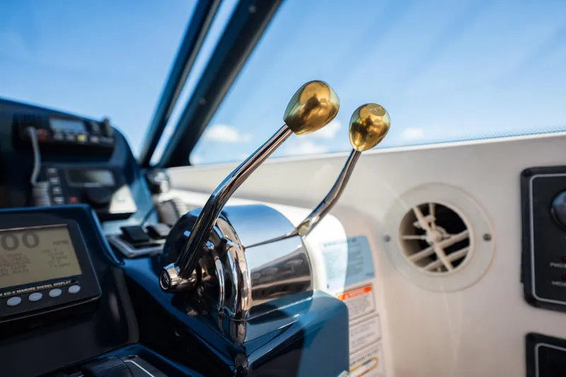 Blue Pearl Yacht Photos Pics Control panel of 2004 Tiara Yachts 4200 Open with throttle levers and navigation instruments.